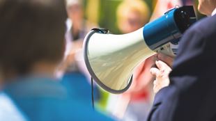 closeup of man with bullhorn 