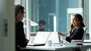 Diverse colleagues working in office setting