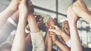 group of arms embracing each other in victory