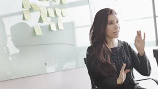 woman in front of white wash board