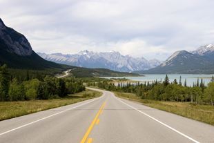 Beautiful landscape of a mountainside road with a lake