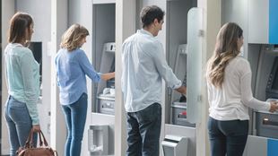 lineup of people at ATM machines