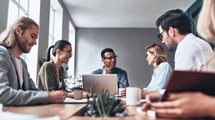 Diverse team around a conference table