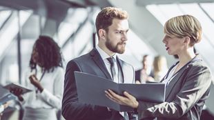 two people discussing a portfolio 