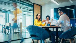 Diverse colleagues working together in a modern boardroom