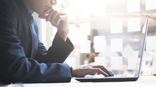 man working on computer laptop