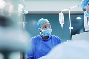 Nurse looking awaywhile working during a medical intervention