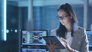 woman working with tablet and computers